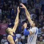 Orlando Magic center Nikola Vucevic, right, puts up a shot in front of Phoenix Suns center Alex Len during the first half of an NBA basketball game in Orlando, Fla., Friday, March 4, 2016. (AP Photo/Phelan M. Ebenhack)