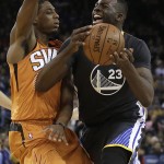 Golden State Warriors' Draymond Green, right, drives against Phoenix Suns' Brandon Knight during the first half of an NBA basketball game Saturday, March 12, 2016, in Oakland, Calif. (AP Photo/Ben Margot)