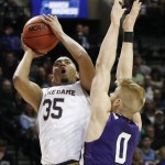 Stephen F. Austin forward Thomas Walkup (0) defends Notre Dame forward Bonzie Colson (35) during the first half of a second-round NCAA men's college basketball tournament game, Sunday, March 20, 2016, in New York. (AP Photo/Kathy Willens)