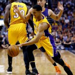 Los Angeles Lakers guard Jordan Clarkson (6) is fouled by Phoenix Suns guard Devin Booker during the first half of an NBA basketball game, Wednesday, March 23, 2016, in Phoenix. (AP Photo/Matt York)