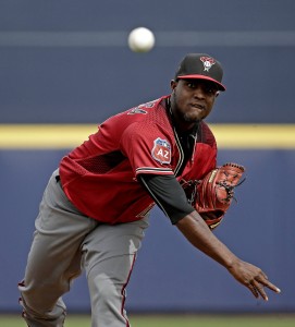 Arizona Diamondbacks starting pitcher Rubby De La Rosa throws during the first inning of a spring training baseball game against the Seattle Mariners Monday, March 7, 2016, in Peoria, Ariz. (AP Photo/Charlie Riedel)