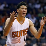 Phoenix Suns guard Devin Booker (1) reacts to a foul against him during the first half of an NBA basketball game against the Memphis Grizzlies, Monday, March 21, 2016, in Phoenix. (AP Photo/Matt York)