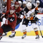 Anaheim Ducks' Jakob Silfverberg (33), of Sweden, skates between Arizona Coyotes' Kevin Connauton (44) and Jarred Tinordi (28) during the first period of an NHL hockey game Thursday, March 3, 2016, in Glendale, Ariz. (AP Photo/Ross D. Franklin)