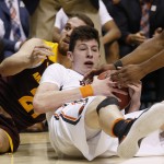 Arizona State forward Eric Jacobsen, left, and Oregon State forward Drew Eubanks scramble on the floor for the ball during the second half of an NCAA college basketball game in the first round of the Pac-12 men's tournament Wednesday, March 9, 2016, in Las Vegas. (AP Photo/John Locher)