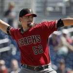 Arizona Diamondbacks' Zack Godley throws a pitch against the San Diego Padres during the first inning of a spring training baseball game, Tuesday, March 8, 2016, in Peoria, Ariz. (AP Photo/Ross D. Franklin)