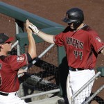 Arizona Diamondbacks' Paul Goldschmidt (44) is congratulated by Peter O'Brien after hitting a two-run home run against the Los Angeles Dodgers during the fifth inning of a spring training baseball game in Scottsdale, Ariz., Friday, March 18, 2016. (AP Photo/Jeff Chiu)