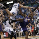 Phoenix Suns guard Ronnie Price (14) loses control of the ball after being fouled by Minnesota Timberwolves forward Nemanja Bjelica (88), of Serbia, during the first half of an NBA basketball game in Minneapolis, Monday, March 28, 2016. (AP Photo/Ann Heisenfelt)