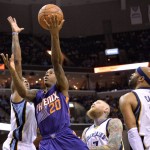Phoenix Suns guard Archie Goodwin (20) shoots between Memphis Grizzlies guard Mario Chalmers, from left, forward Chris Andersen, and guard Vince Carter (15)  in the first half of an NBA basketball game Sunday, March 6, 2016, in Memphis, Tenn. (AP Photo/Brandon Dill)