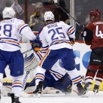 Arizona Coyotes' Alex Tanguay (40) beats Edmonton Oilers' Cam Talbot for a goal as Oilers' Darnell Nurse (25) and Lauri Korpikoski (28), of Finland, look on during the first period of an NHL hockey game Tuesday, March 22, 2016, in Glendale, Ariz. (AP Photo/Ross D. Franklin)