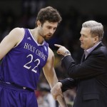 Holy Cross head coach Bill Carmody, right, speaks with guard Robert Champion (22) during the first half of a first-round men's college basketball game against Oregon in the NCAA Tournament in Spokane, Wash., Friday, March 18, 2016. (AP Photo/Young Kwak)