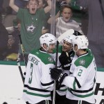 Dallas Stars left wing Jamie Benn, center celebrates scoring a goal with teammates John Klingberg (3) and Kris Russell (2) during the second period of an NHL hockey game against the Arizona Coyotes on Thursday, March 31, 2016, in Dallas. (AP Photo/LM Otero)