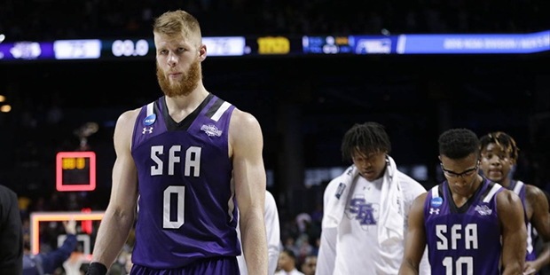 Stephen F. Austin's Thomas Walkup (0) and Trey Pinkney (10) leave the court after a second-round me...