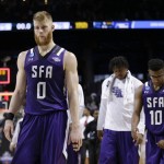 Stephen F. Austin's Thomas Walkup (0) and Trey Pinkney (10) leave the court after a second-round men's college basketball game against Notre Dame in the NCAA Tournament, Sunday, March 20, 2016, in New York. Notre Dame won 76-75. (AP Photo/Frank Franklin II)