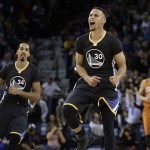 
              Golden State Warriors' Stephen Curry celebrates a score against the Phoenix Suns in the final seconds of the NBA basketball game Saturday, March 12, 2016, in Oakland, Calif. (AP Photo/Ben Margot)
            