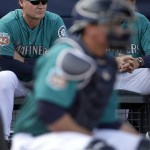 Seattle Mariners manager Scott Servais, left, watches during the fifth inning of a spring training baseball game against the Arizona Diamondbacks Monday, March 7, 2016, in Peoria, Ariz. (AP Photo/Charlie Riedel)