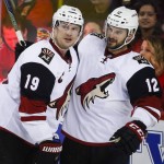 Arizona Coyotes' Brad Richardson, right, celebrates his goal with teammate Shane Doan during the third period of an NHL hockey game against the Calgary Flames, Friday, March 11, 2016, in Calgary, Alberta. (Jeff McIntosh/The Canadian Press via AP) MANDATORY CREDIT