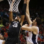 Colorado forward Josh Scott (40) shoots over Arizona center Dusan Ristic during the first half of an NCAA college basketball game in the quarterfinals of the Pac-12 men's tournament Thursday, March 10, 2016, in Las Vegas. (AP Photo/John Locher)