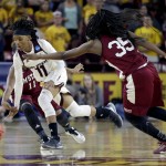 Arizona State guard Peace McNamara (11) pushes the ball up court as New Mexico State guards Shanice Davis (11) and Moriah Mack (35) defend during the second half of a first-round women's college basketball game in the NCAA Tournament, Friday, March 18, 2016, in Tempe, Ariz. Arizona State won 74-52. (AP Photo/Matt York)