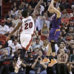 Phoenix Suns guard Devin Booker (1) prepares to shoot as Miami Heat forward Justise Winslow (20) defends during the second half of an NBA basketball game, Thursday, March 3, 2016, in Miami. (AP Photo/Alan Diaz)