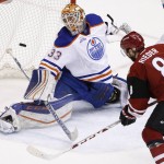 Arizona Coyotes' Tobias Rieder (8), of Germany, scores a goal against Edmonton Oilers' Cam Talbot (33) during the second period of an NHL hockey game, Tuesday, March 22, 2016, in Glendale, Ariz. (AP Photo/Ross D. Franklin)