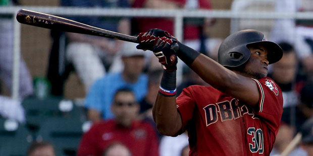 Arizona Diamondbacks' Socrates Brito watches his RBI double against the Los Angeles Angels during t...