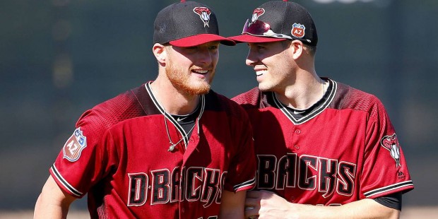 Arizona Diamondbacks pitchers Shelby Miller, left, and Patrick Corbin laugh during a spring trainin...