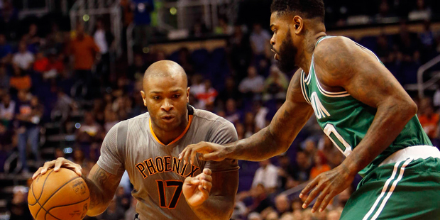 Phoenix Suns forward P.J. Tucker (17) drives on Boston Celtics forward Jae Crowder in the first qua...