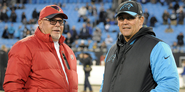 Carolina Panthers head coach Ron Rivera talks to Arizona Cardinals head coach Bruce Arians before t...