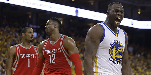 Golden State Warriors' Draymond Green, right, yells after being fouled by Houston Rockets' Dwight H...