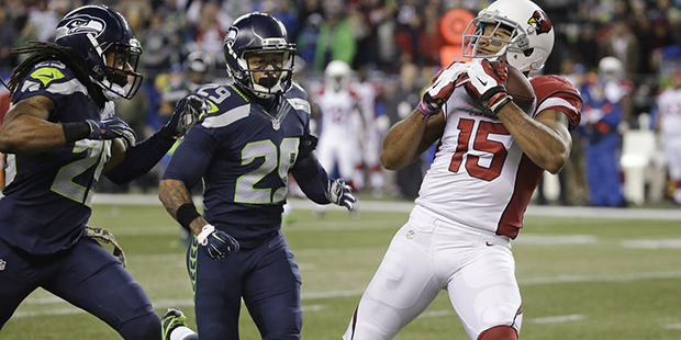 Arizona Cardinals wide receiver Michael Floyd (15) makes a catch as Seattle Seahawks free safety Ea...