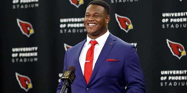 Arizona Cardinals' first-round draft pick D.J. Humphries smiles after being introduced to the media...
