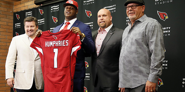 Arizona Cardinals' first-round draft pick D.J. Humphries holds his jersey for a photograph with Car...