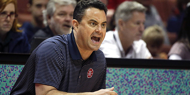 Arizona head coach Sean Miller directs his team during the first half of an NCAA college basketball...