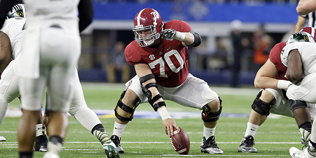 Alabama offensive lineman Ryan Kelly (70) sets up for a play against Michigan State during the firs...