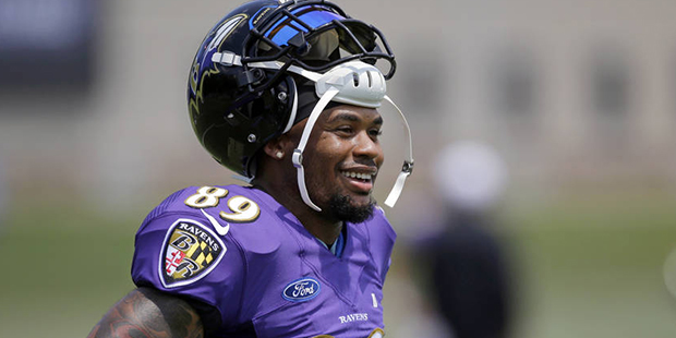 FILE - In this Aug. 1, 2015, file photo, Baltimore Ravens wide receiver Steve Smith stands on the f...
