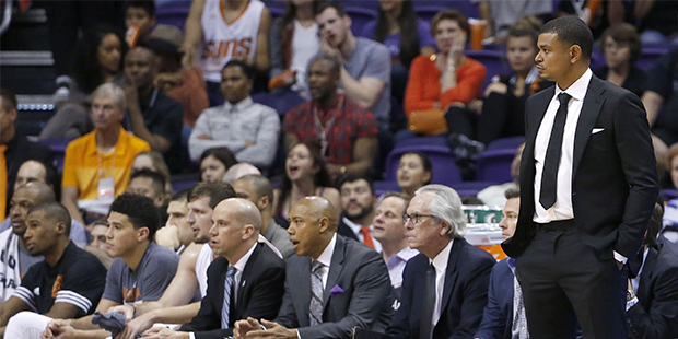 In this Wednesday, April 13, 2016, photo, Phoenix Suns interim coach Earl Watson, right, watches th...