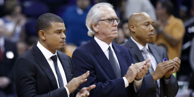 Phoenix Suns head coach Earl Watson, left, stands with assistant coaches Bob Hill, middle, and Core...