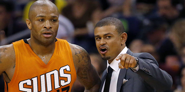 Phoenix Suns forward P.J. Tucker (17) talks with coach Earl Watson during the second half of the te...