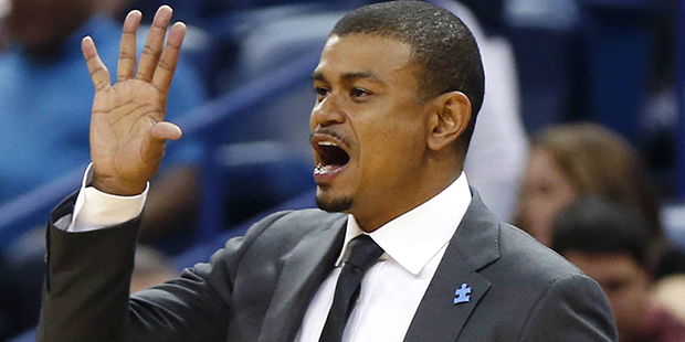 Phoenix Suns head coach Earl Watson calls out from the bench in the second half of an NBA basketbal...