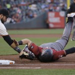 Arizona Diamondbacks' Brandon Drury, right, is tagged out by San Francisco Giants first baseman Brandon Belt after being picked off during the first inning of a baseball game in San Francisco, Wednesday, April 20, 2016. (AP Photo/Jeff Chiu)