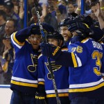 St. Louis Blues' Alex Pietrangelo, third from left, celebrates with teammates Paul Stastny, left, Jaden Schwartz Troy Brouwer after scoring a goal during the second period of an NHL hockey game against the Arizona Coyotes, Monday, April 4, 2016, in St. Louis. (AP Photo/Billy Hurst)
