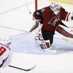 Arizona Coyotes' Mike Smith (41) makes a save on a shot by Washington Capitals' Alex Ovechkin (8), of Russia, during the second period of an NHL hockey game Saturday, April 2, 2016, in Glendale, Ariz. (AP Photo/Ross D. Franklin)
