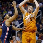 Phoenix Suns forward Mirza Teletovic (35) shoots as Washington Wizards forward Jared Dudley defends during the second half of an NBA basketball game, Friday, April 1, 2016, in Phoenix. (AP Photo/Matt York)