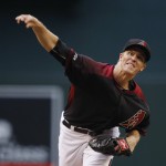 Arizona Diamondbacks' Zack Greinke throws a pitch against the Chicago Cubs during the first inning of a baseball game Saturday, April 9, 2016, in Phoenix. (AP Photo/Ross D. Franklin)