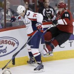 Washington Capitals' John Carlson (74) beats Arizona Coyotes' Shane Doan (19) to the puck during the second period of an NHL hockey game Saturday, April 2, 2016, in Glendale, Ariz. (AP Photo/Ross D. Franklin)