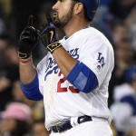 Los Angeles Dodgers' Adrian Gonzalez celebrates a solo home run as he crosses home plate during the fourth inning of a baseball game against the Arizona Diamondbacks in Los Angeles, Wednesday, April 13, 2016. (AP Photo/Kelvin Kuo)