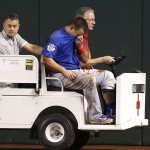 An injured Chicago Cubs' Kyle Schwarber, front, is taken off the field during the second inning of a baseball game against the Arizona Diamondbacks Thursday, April 7, 2016, in Phoenix. (AP Photo/Ross D. Franklin)
