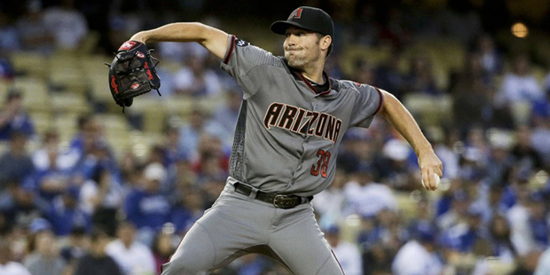 Arizona Diamondbacks starting pitcher Robbie Ray throws against the Los Angeles Dodgers during firs...