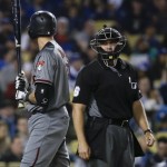 Arizona Diamondbacks' Nick Ahmed, left, exchanges words with home plate umpire Mark Carlson after striking out during the third inning of a baseball game against the Los Angeles Dodgers in Los Angeles, Thursday, April 14, 2016. (AP Photo/Chris Carlson)