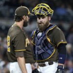 San Diego Padres catcher Derek Norris talks with pitcher James Shields after Shields surrendered the tying run to the Arizona Diamondbacks during the seventh inning of a baseball game Friday, April 15, 2016, in San Diego. (AP Photo/Lenny Ignelzi)